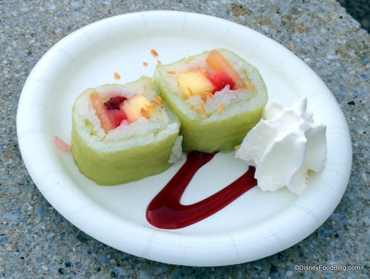 Frushi-Fresh-strawberries-pineapple-and-cantaloupe-rolled-with-coconut-rice-atop-a-raspberry-sauce-sprinkled-with-toasted-coconut-and-whipped-cream.jpg