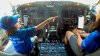 The New Flight Crew - Samuel and Anna on the flight deck of the jet that took us to Orlando.jpg
