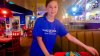 Sitting down to Eat - Rachel with pizza at GKTW dining room.jpg
