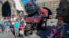 Hogwart's Family - The family poses in front of the Hogwart's Express.jpg