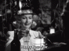 Classic-Happy-New-Years-Eve-Toast-In-Sawdust-and-Tinsel.gif