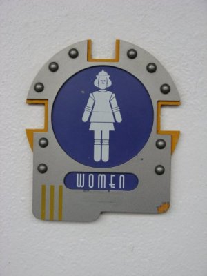 sign tomorrowland bathroom girls.jpg