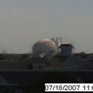 Crane dismantling Spaceship Earth appendage