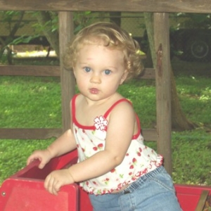 Amelia in red wagon