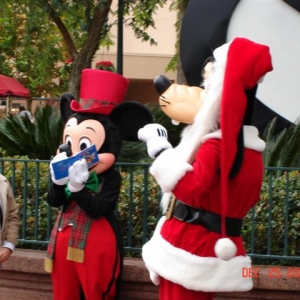 Mickey and Goofy dressed like Santa!
