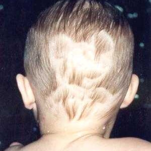 Mickey carved into Evan's hair.