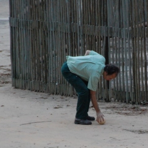 AKV Animal Keeper retrieving an ostrich egg