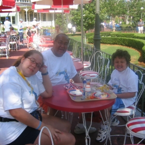 Me, Dad, and Daniel eating on Main Street