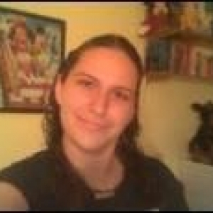 AT HOME WITH DISNEY POSTER IN BACKGROUND