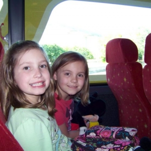 Emma & Ashley riding the Magical Express