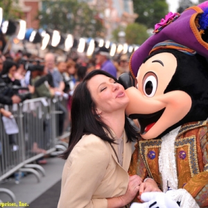Actress Lynn Collins and Mickey Mouse