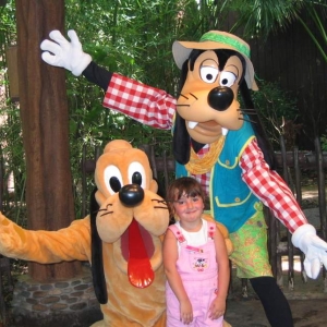 Caitlyn with Pluto and Goofy