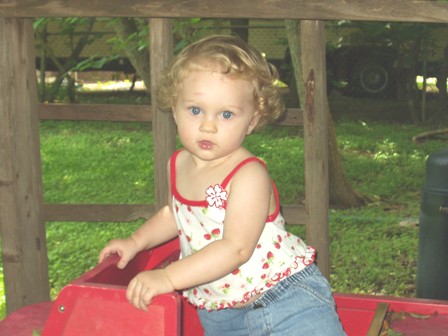 Amelia in red wagon