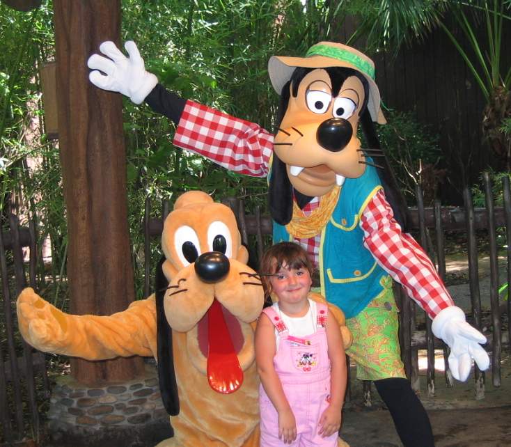 Caitlyn with Pluto and Goofy