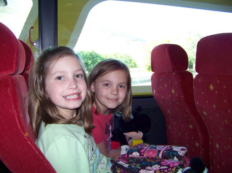 Emma & Ashley riding the Magical Express
