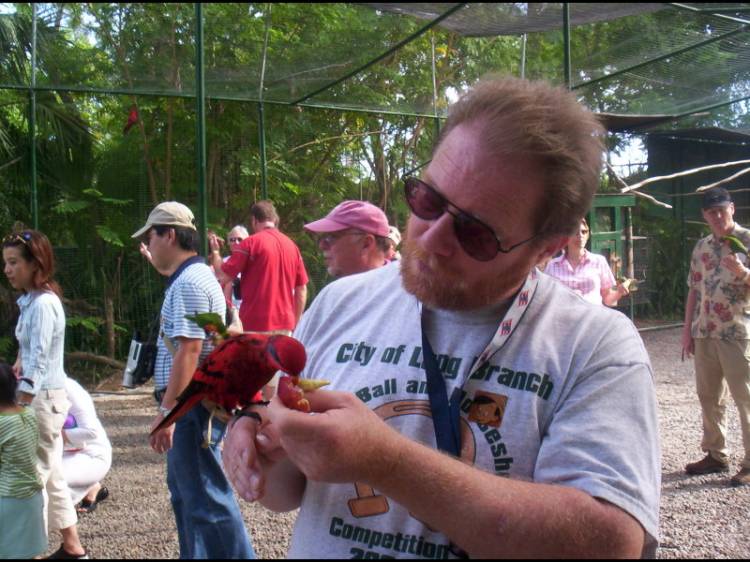 Jim feeds the Parrots at Ardastra Gardens