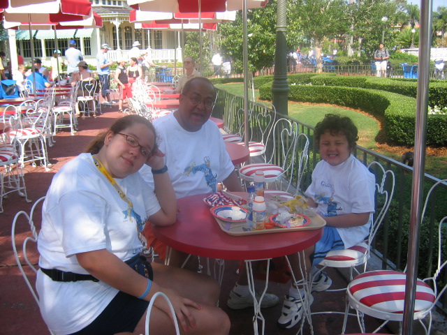 Me, Dad, and Daniel eating on Main Street