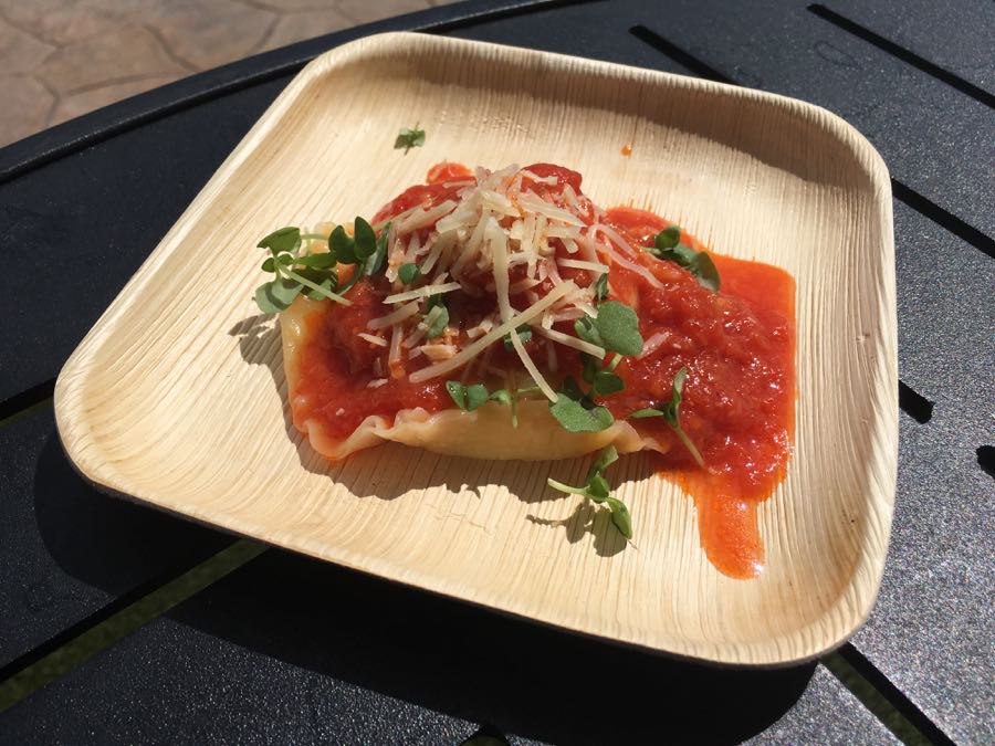 Ricotta And Zucchini Raviolo Served With Rustic Tomato Sauce