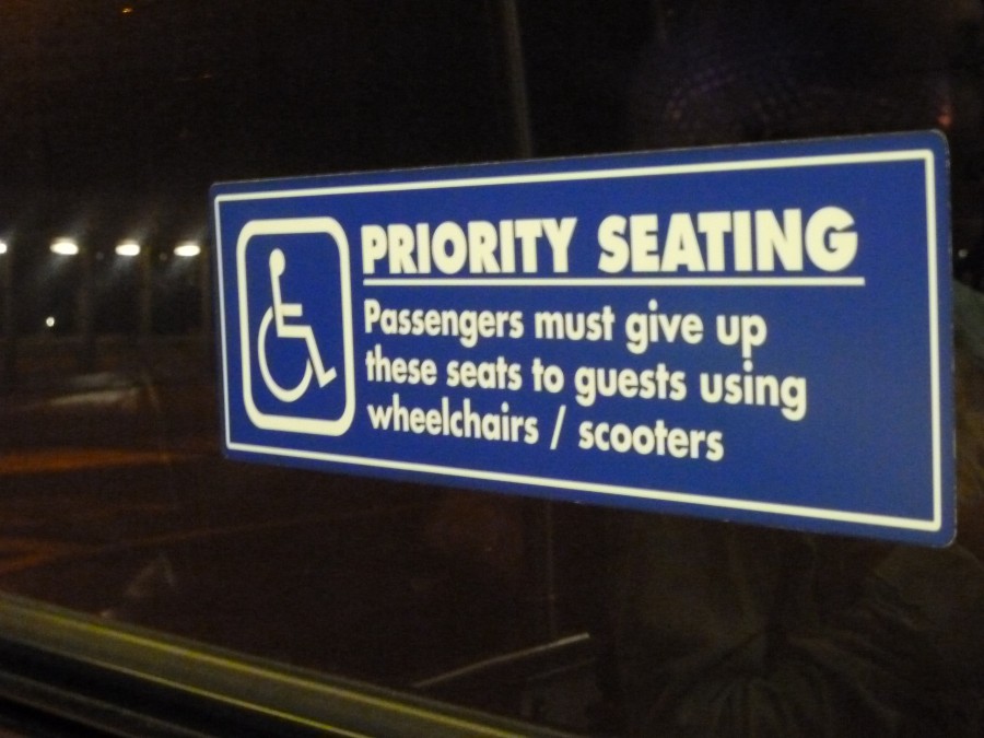 Sign above bus seat