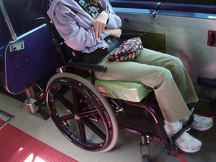 wheelchair tied down on bus