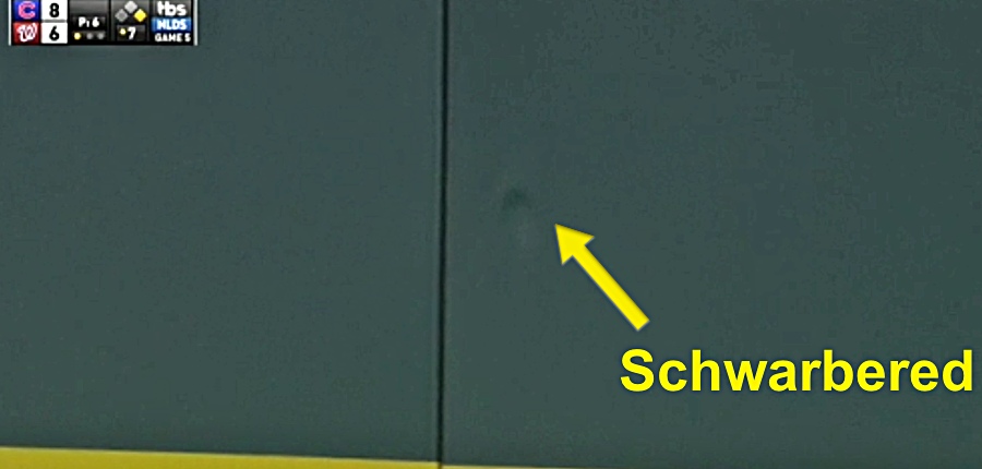 kyle-schwarber-outfield-wall-dent.jpg