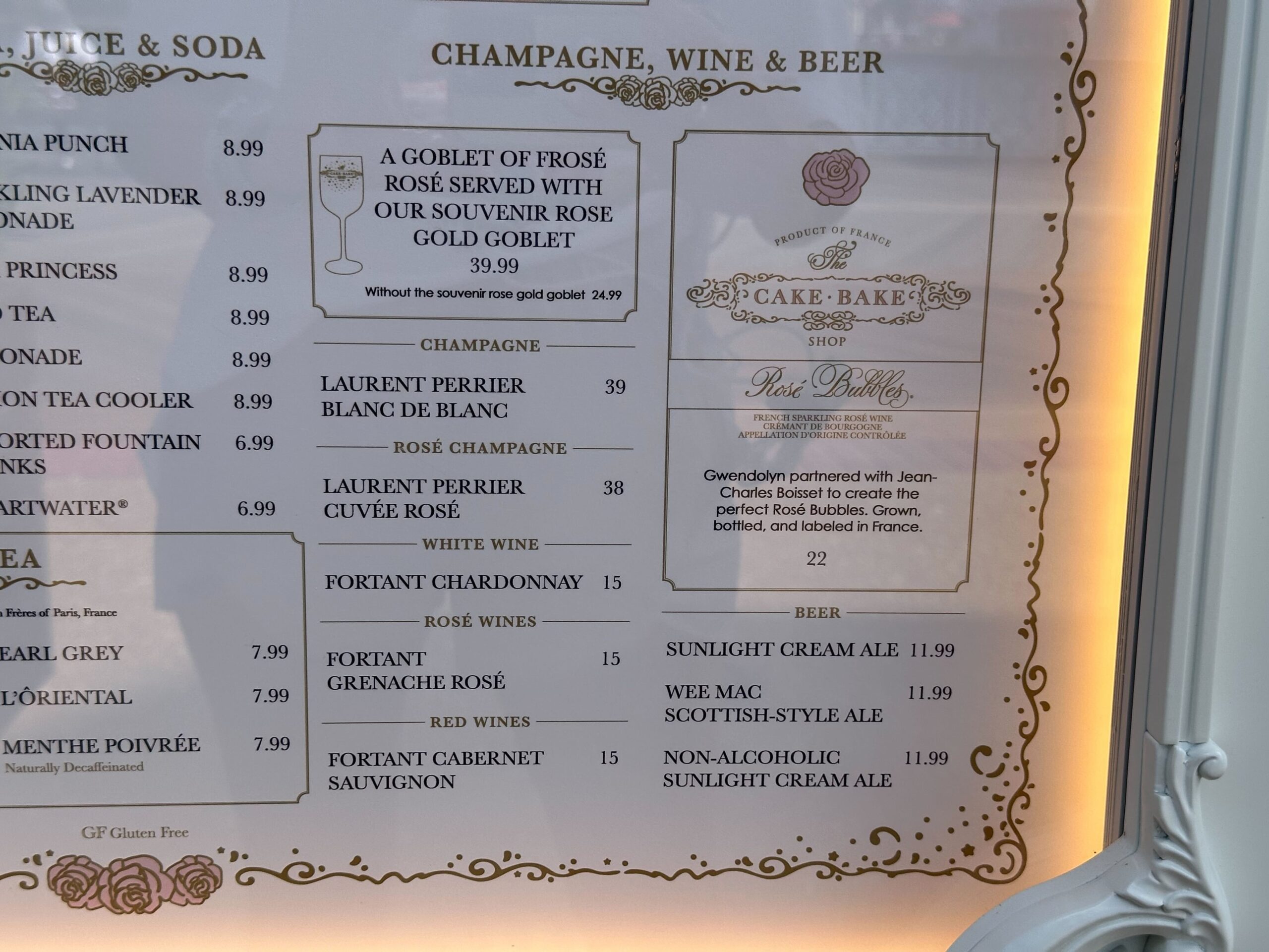 The menu at our cake bake shop showcases prices for an array of drinks, including champagne, rosé, and beer. Don't miss out on our unique cake bake option featuring delectable goat cheese.