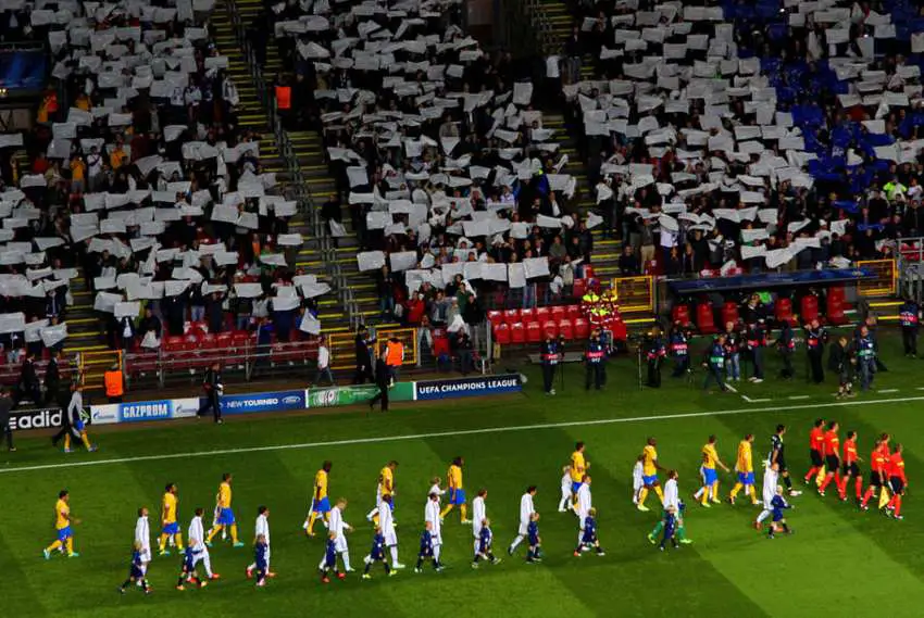 soccer-players-walk-out-with-kids.jpg