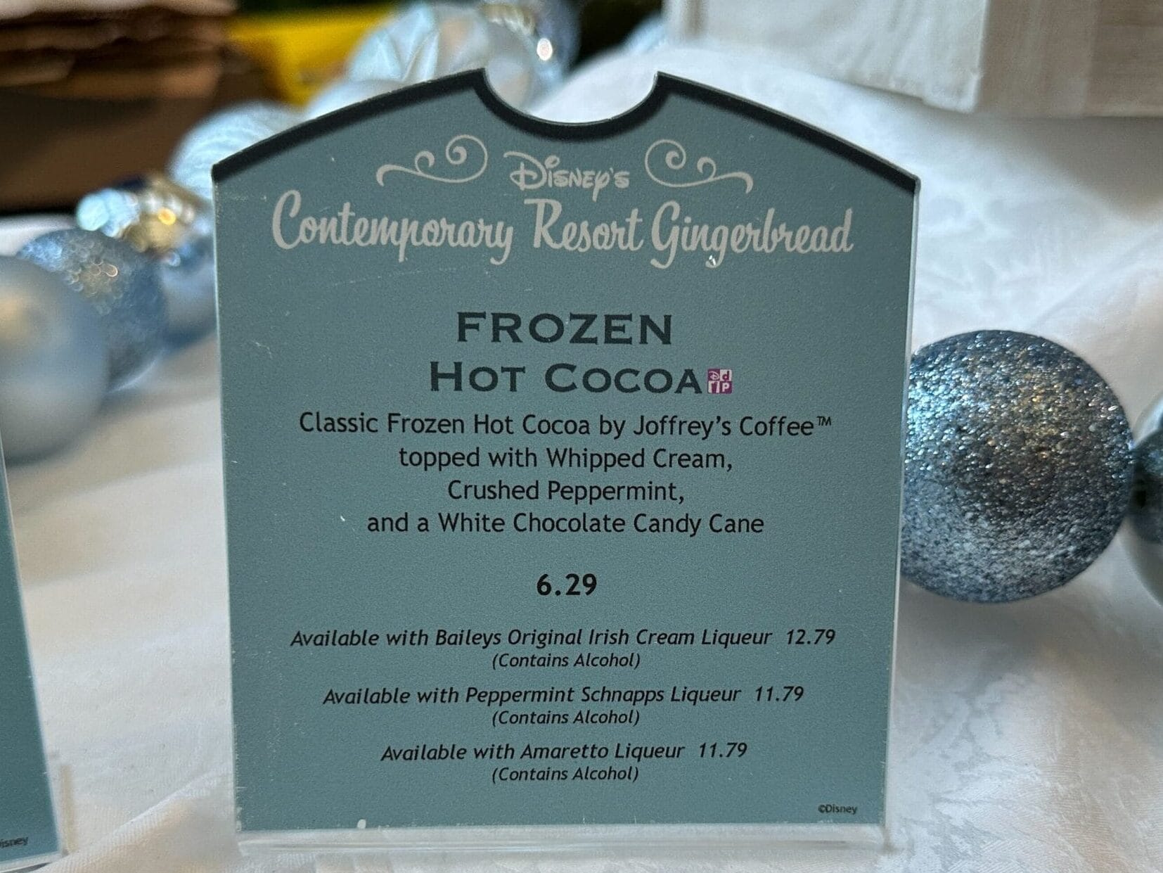 Classic Frozen Hot Cocoa by Joffrey’s Coffee topped with Whipped Cream, Crushed Peppermint, and a White Chocolate Candy Cane