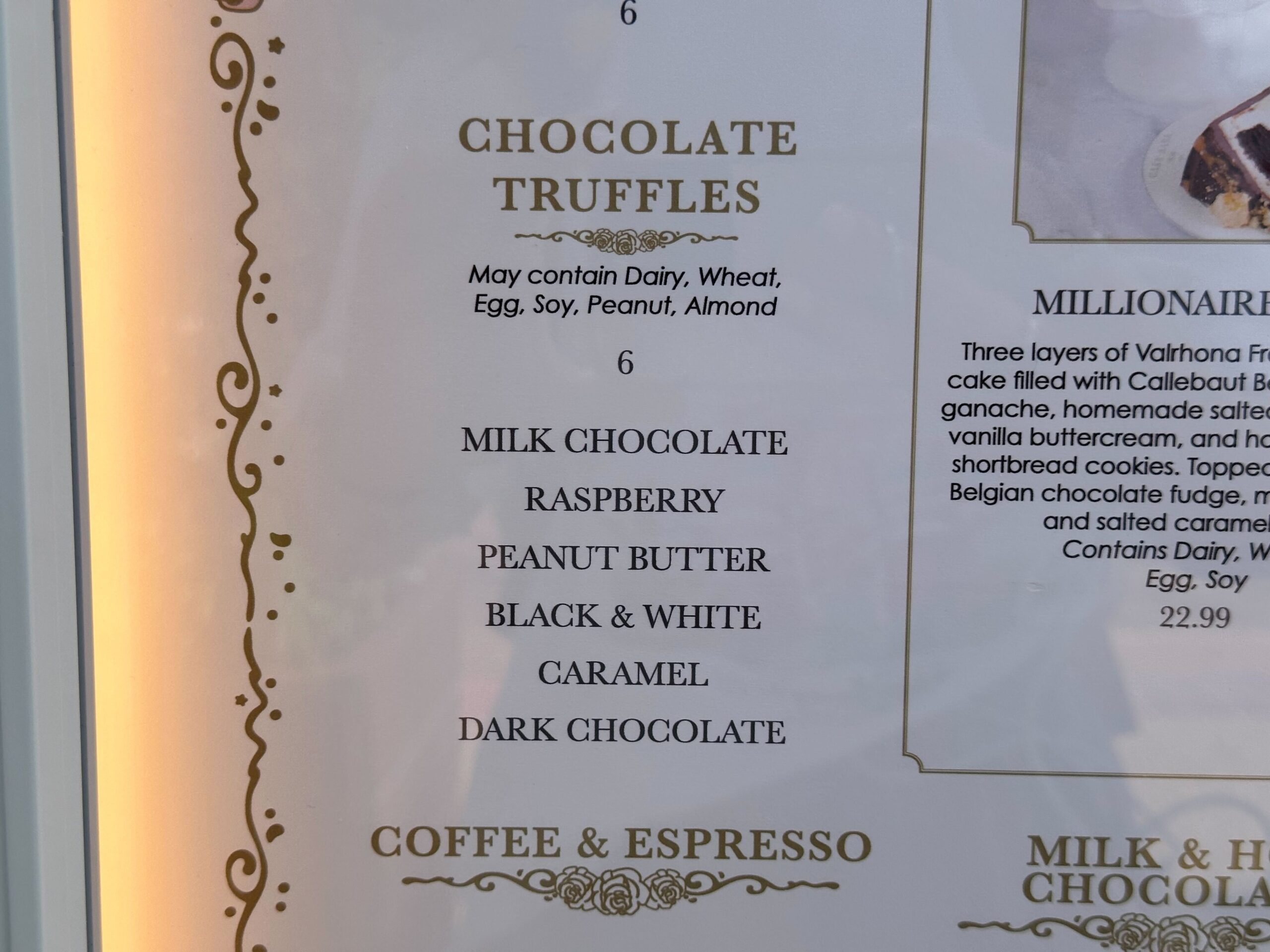 Indulge in our cake bake shop's selection of chocolate truffles, featuring flavors like milk chocolate, raspberry, peanut butter, black & white, caramel, and dark chocolate. Each delectable treat comes complete with allergy information for your peace of mind.