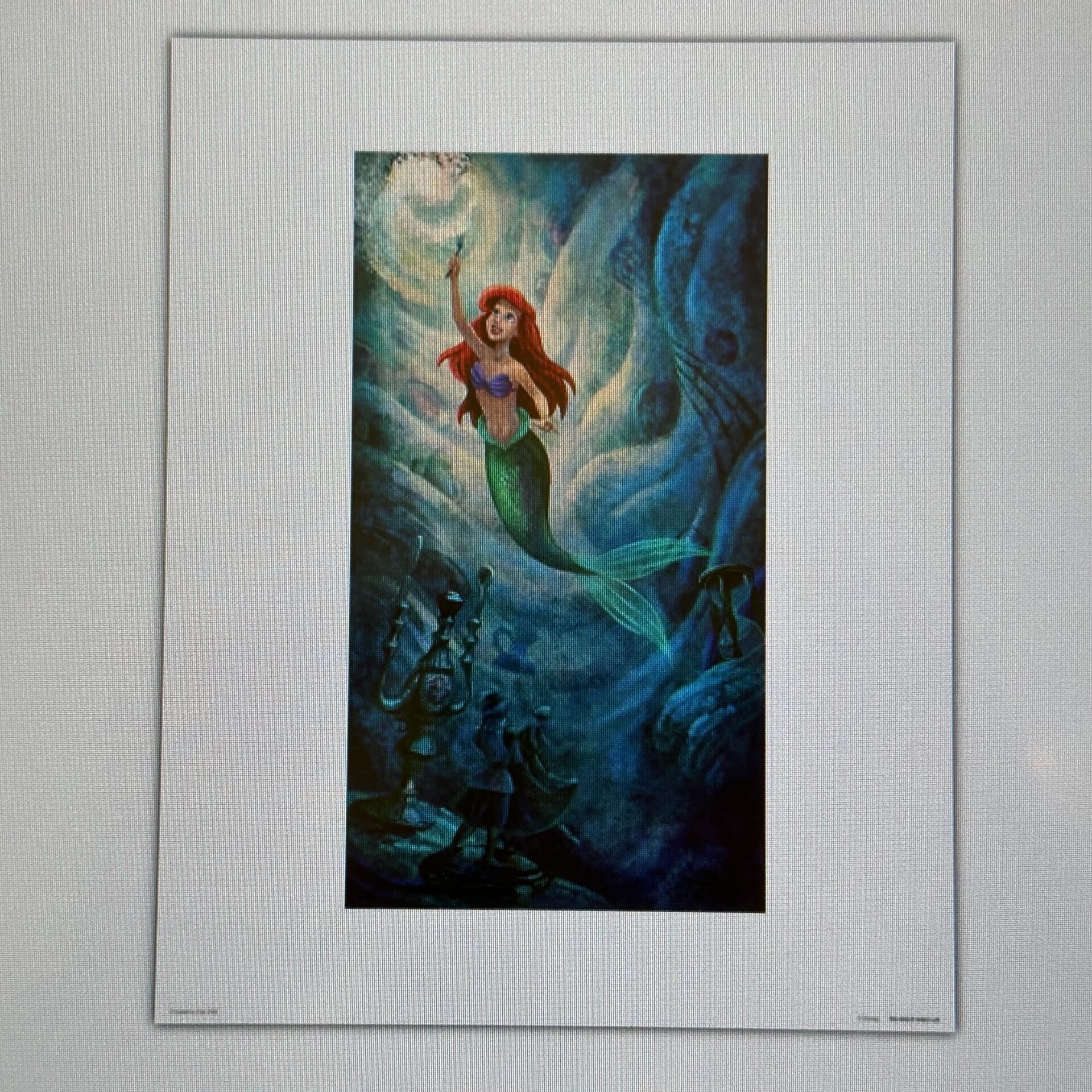 This Grand Floridian Art piece showcases a stunning mermaid with red hair and a green tail, holding a fork amid vibrant sea creatures in a mesmerizing blue aquatic setting. Perfect for any space, it's available through our On Demand Kiosk for resort-inspired elegance.