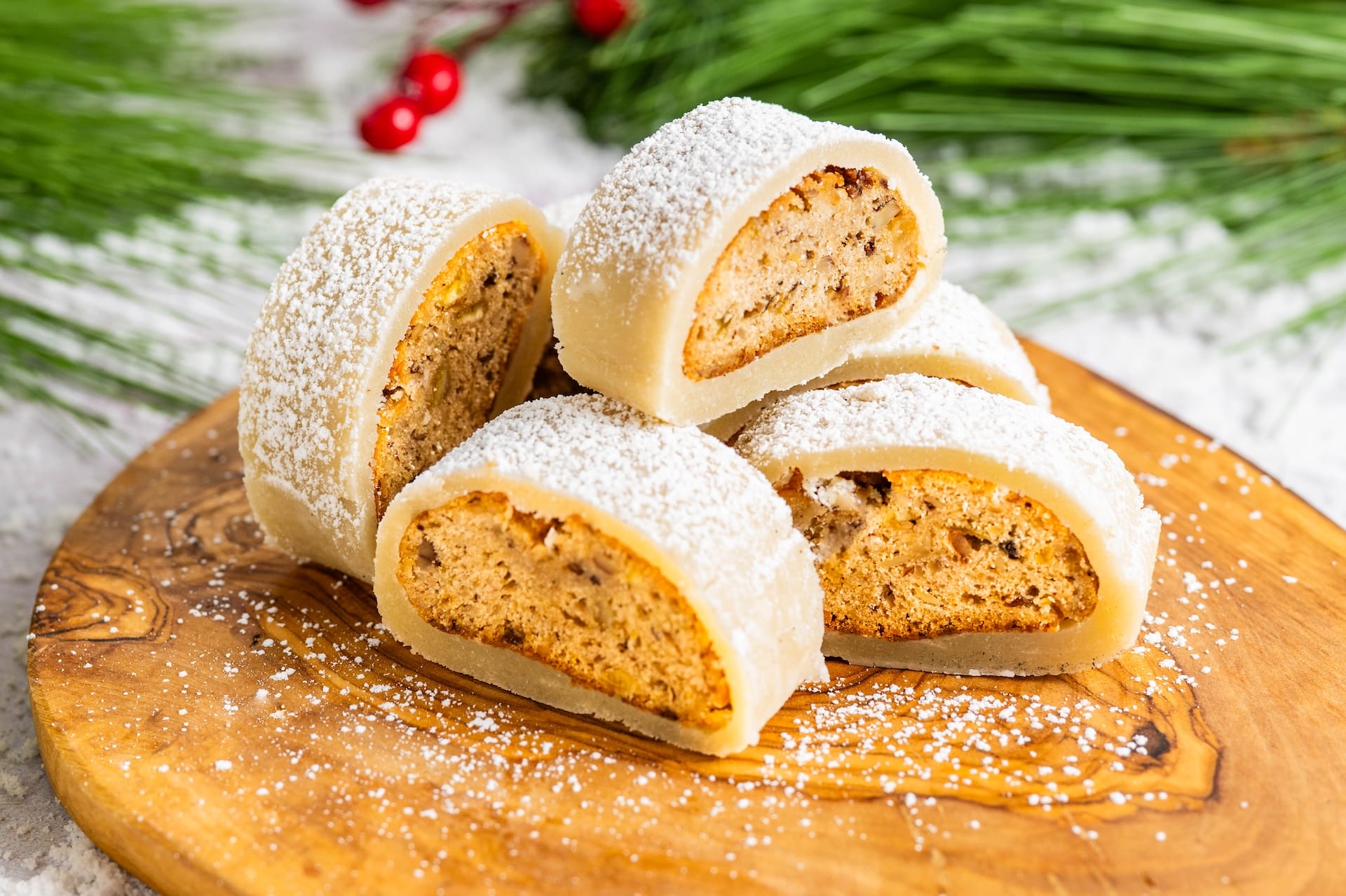 Four slices of marzipan Stollen with a snowy dusting of sugar, featured for 2025 Holiday Food at Walt Disney World Resort.
