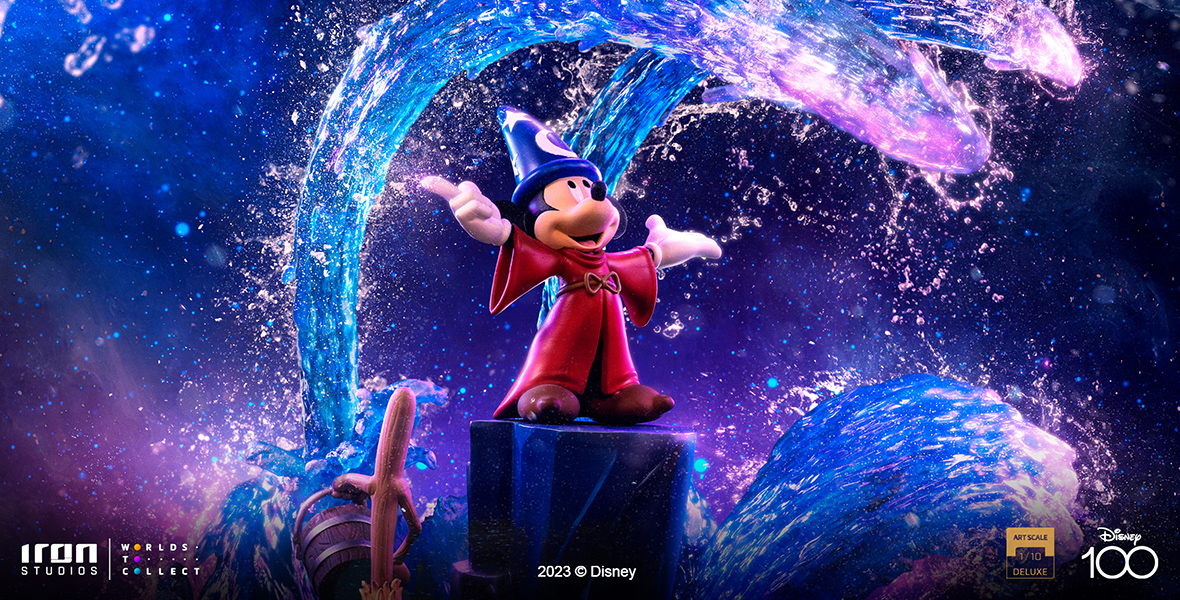 The Iron Studios figurine of Sorcerer Mickey is seen at the center, with the Iron Studios logo at bottom left. The Disney100 logo is at bottom right. 