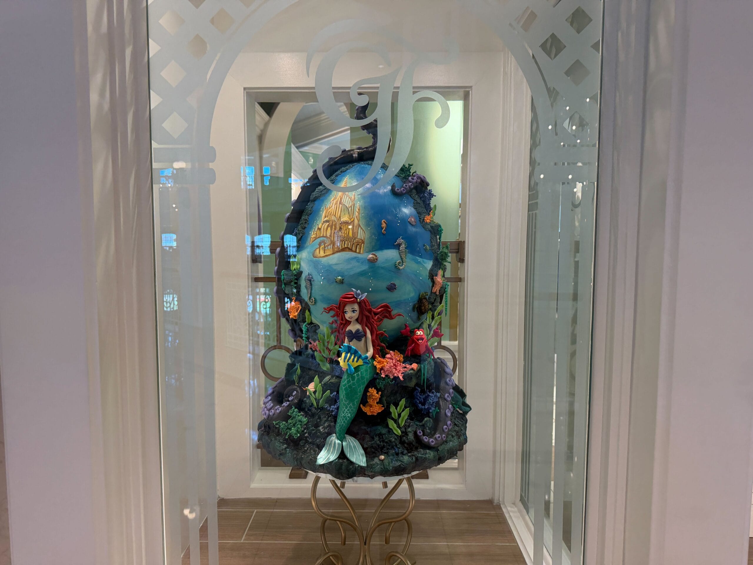 Chocolate Easter egg display themed to The Little Mermaid in the lobby of the Grand Floridian Resort at Walt Disney World