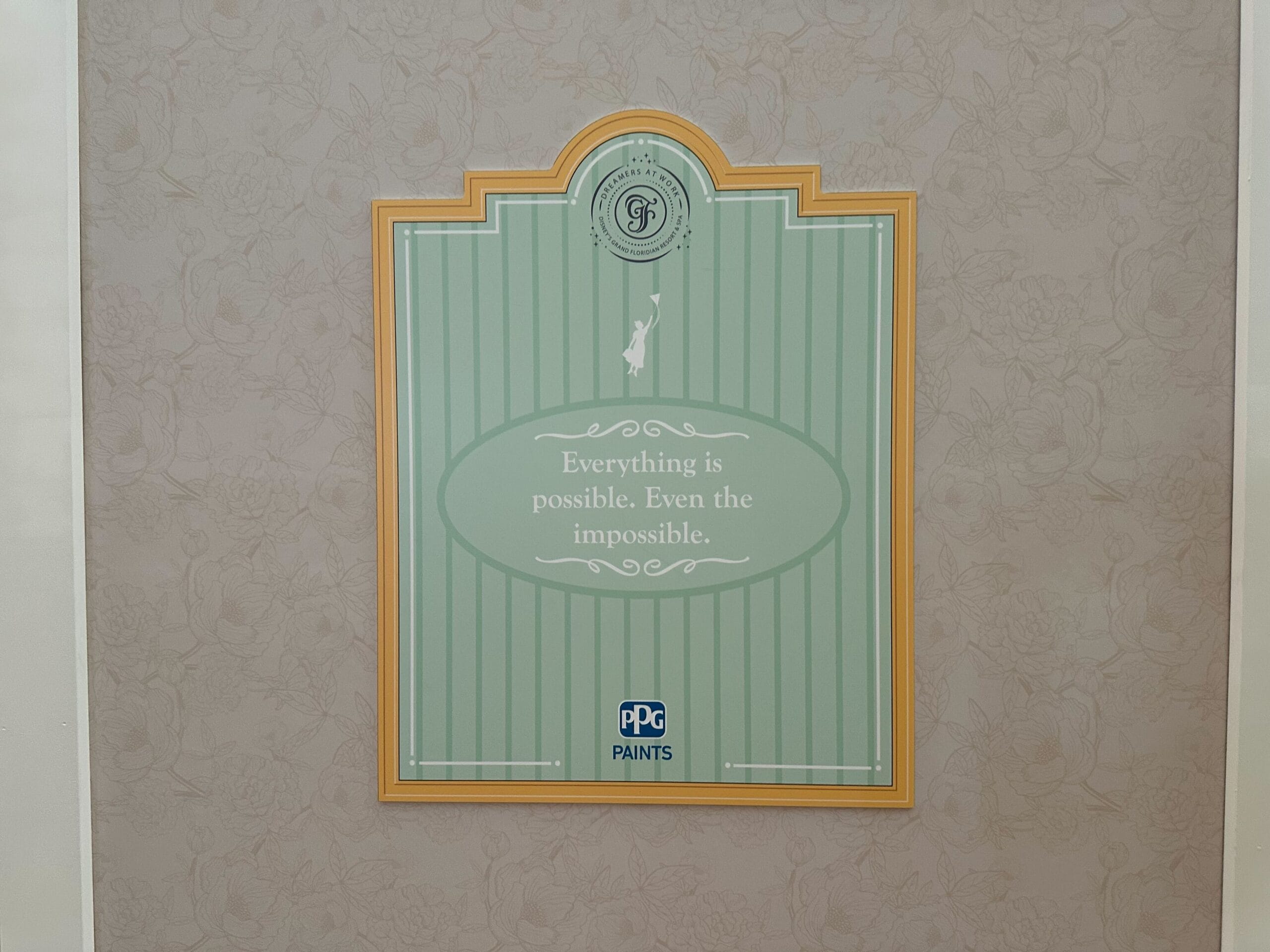 Green and gold framed sign features new signage at Grand Floridian; PPG Paints logo appears at the bottom.