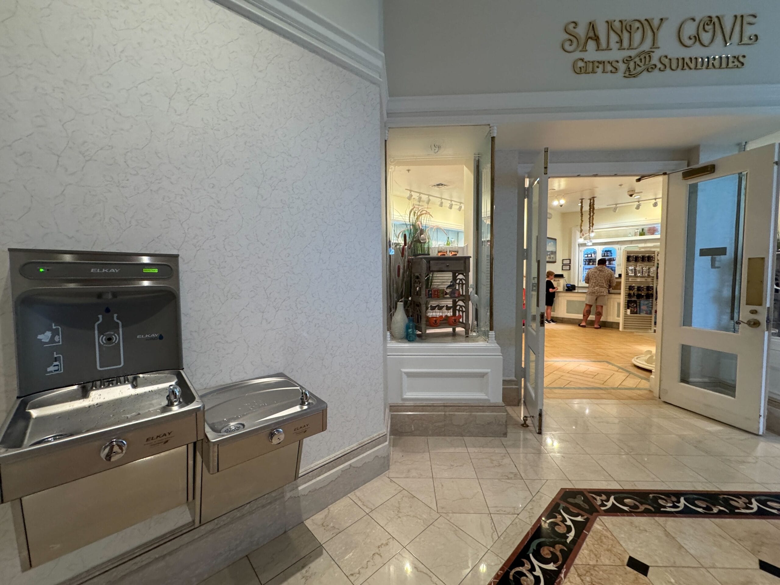 Water fountains by Sandy Cove Gifts at the Grand Floridian Resort lobby, now open—evoking classic Disney elegance after refurbishment.