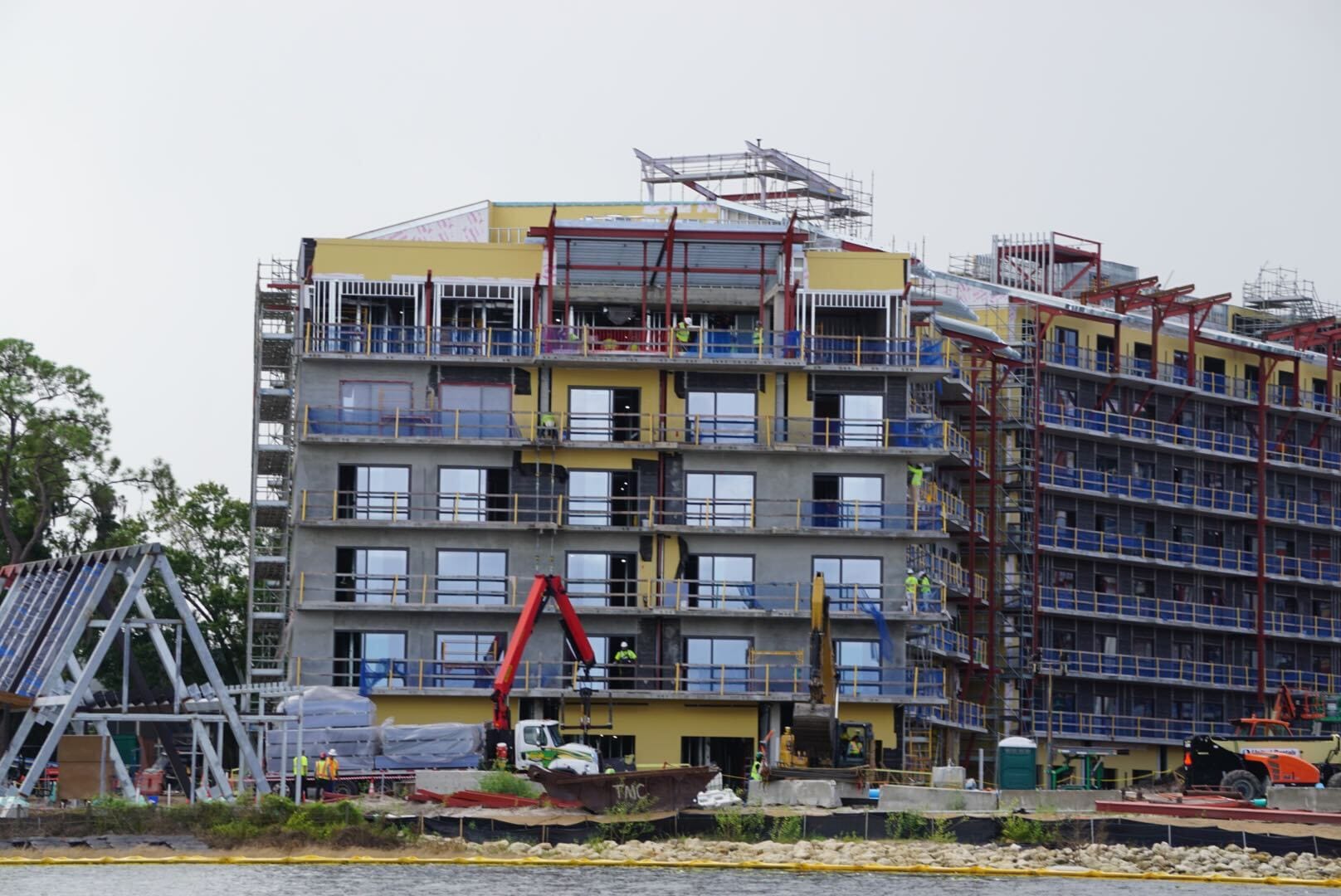 Construction updates: Workers and scaffolding surround the multi-story Lakeshore Lodge rising by the water.
