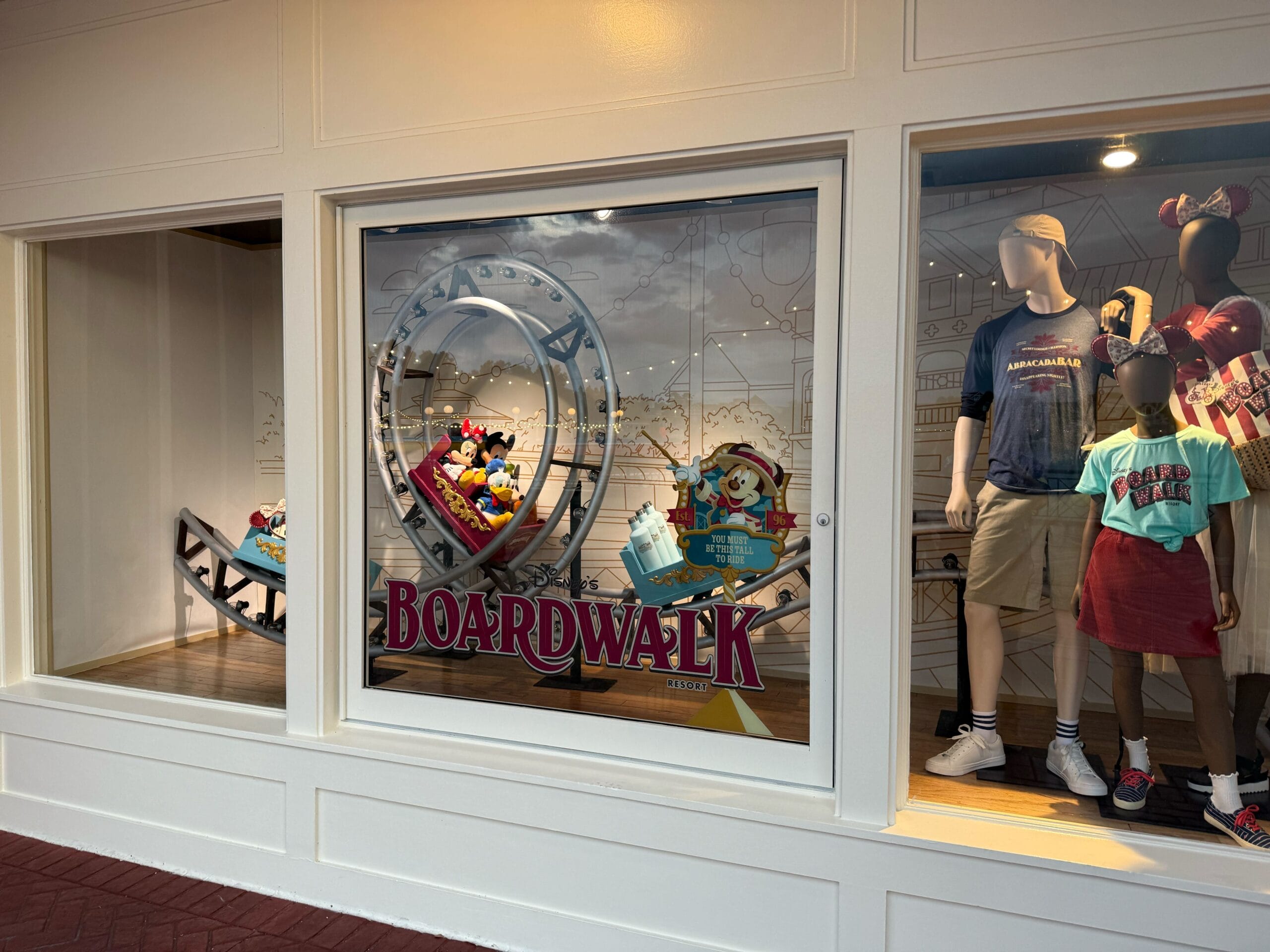 Storefront window display with Disney's BoardWalk mannequins and a rollercoaster scene featuring Mickey and Minnie Mouse. Storefront window display with Disney's BoardWalk mannequins and a rollercoaster scene featuring Mickey and Minnie Mouse.