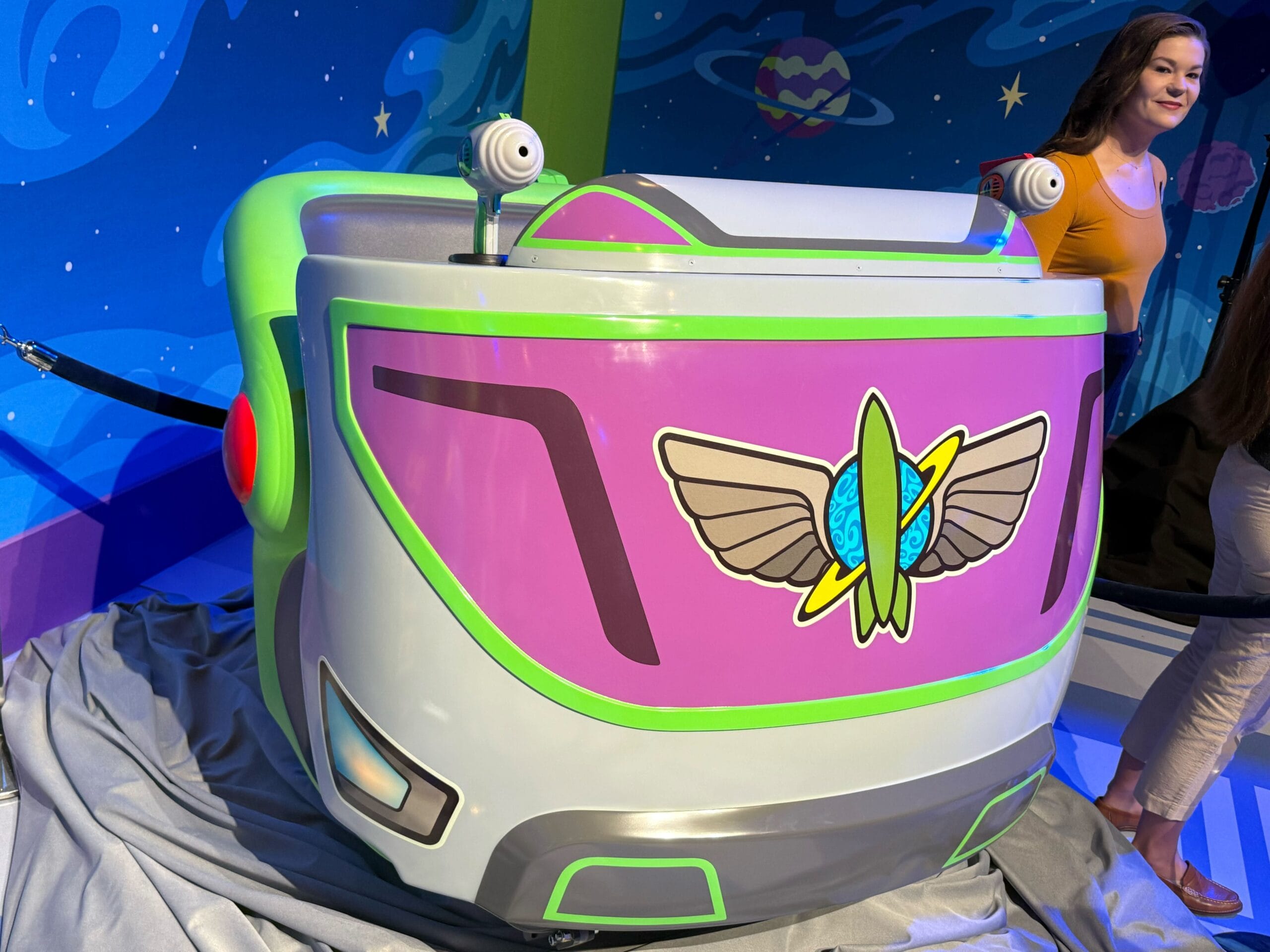 Get a first look at the colorful, space-themed new ride vehicles for Buzz Lightyear Space Ranger Spin, displayed indoors. Get a first look at the colorful, space-themed new ride vehicles for Buzz Lightyear Space Ranger Spin, displayed indoors.
