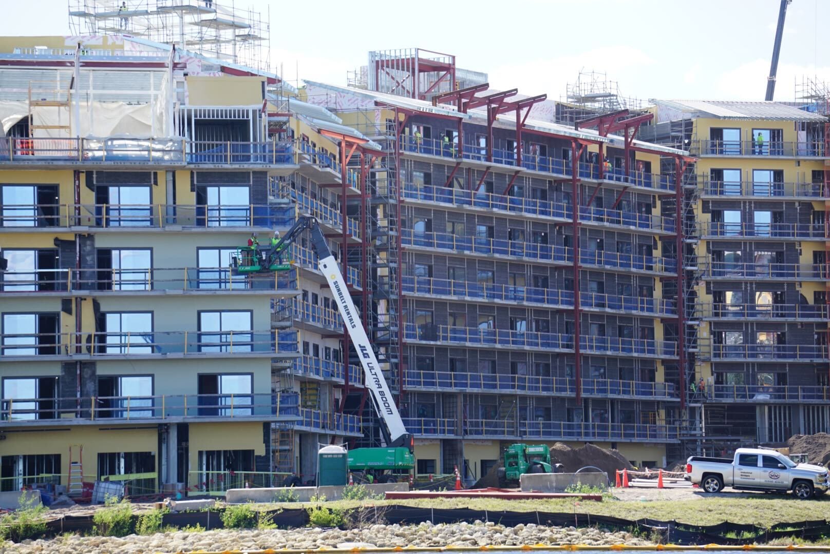 Construction workers on a lift work on the exterior of the Lakeshore building, though no Disney castle turrets or details are seen here. Construction workers on a lift work on the exterior of the Lakeshore building, though no Disney castle turrets or details are seen here.