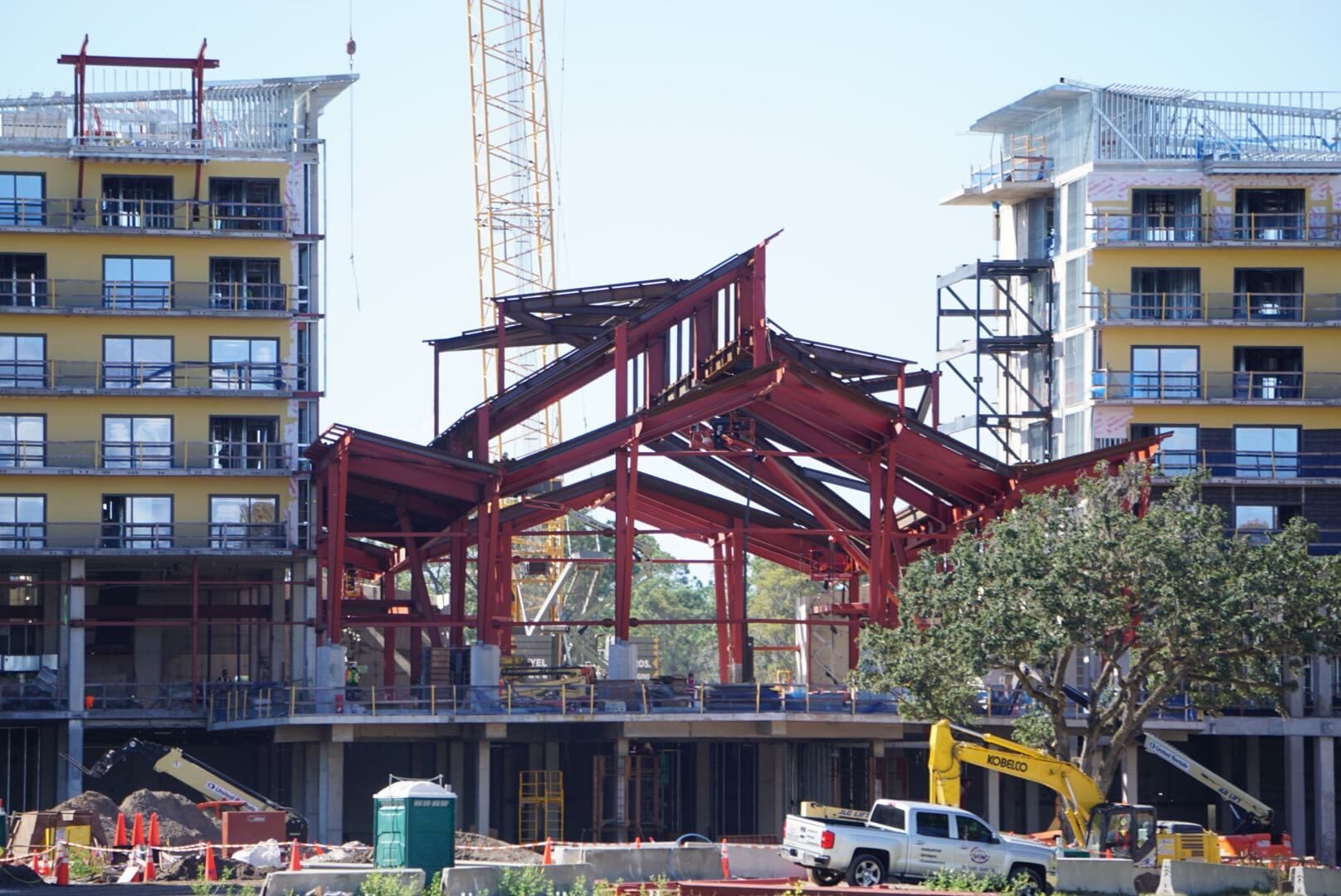 Lakeshore Update: Steel framework rises between two partially built structures, cranes and vehicles nearby—no Disney castle in sight. Lakeshore Update: Steel framework rises between two partially built structures, cranes and vehicles nearby—no Disney castle in sight.
