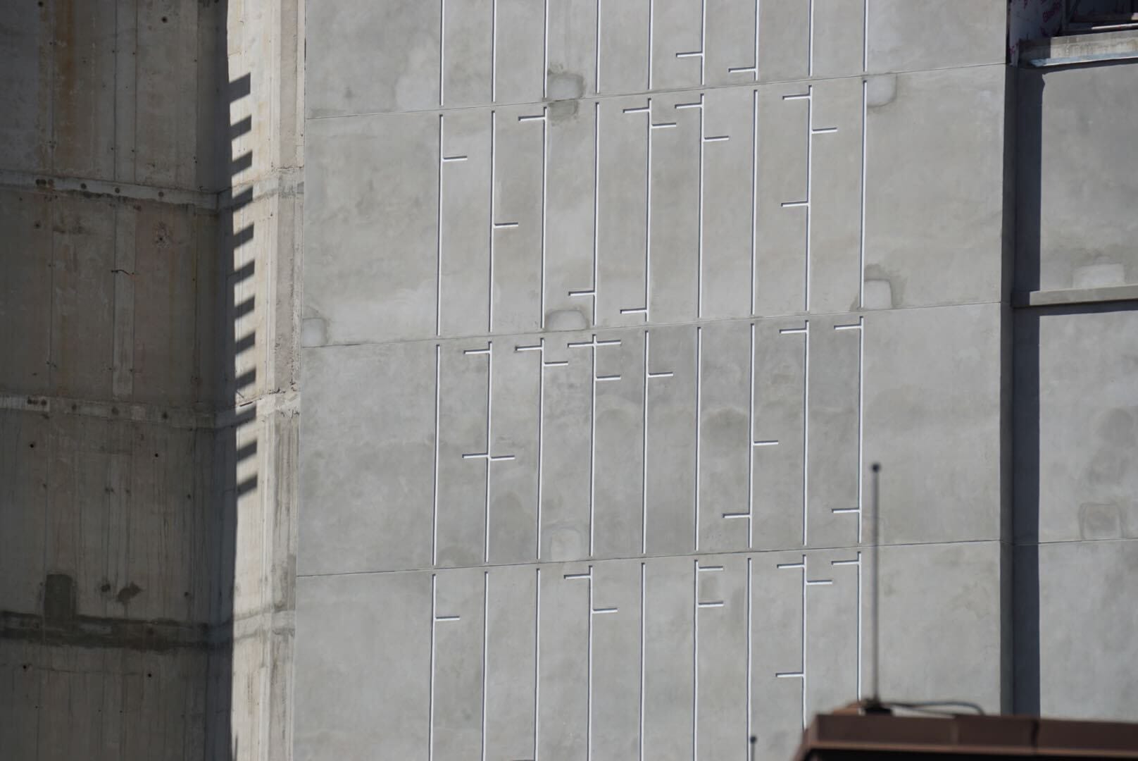 A concrete wall with geometric lines cast in shadow, reminiscent of Tomorrowland architecture at Disneyland, from Lakeshore Update. A concrete wall with geometric lines cast in shadow, reminiscent of Tomorrowland architecture at Disneyland, from Lakeshore Update.