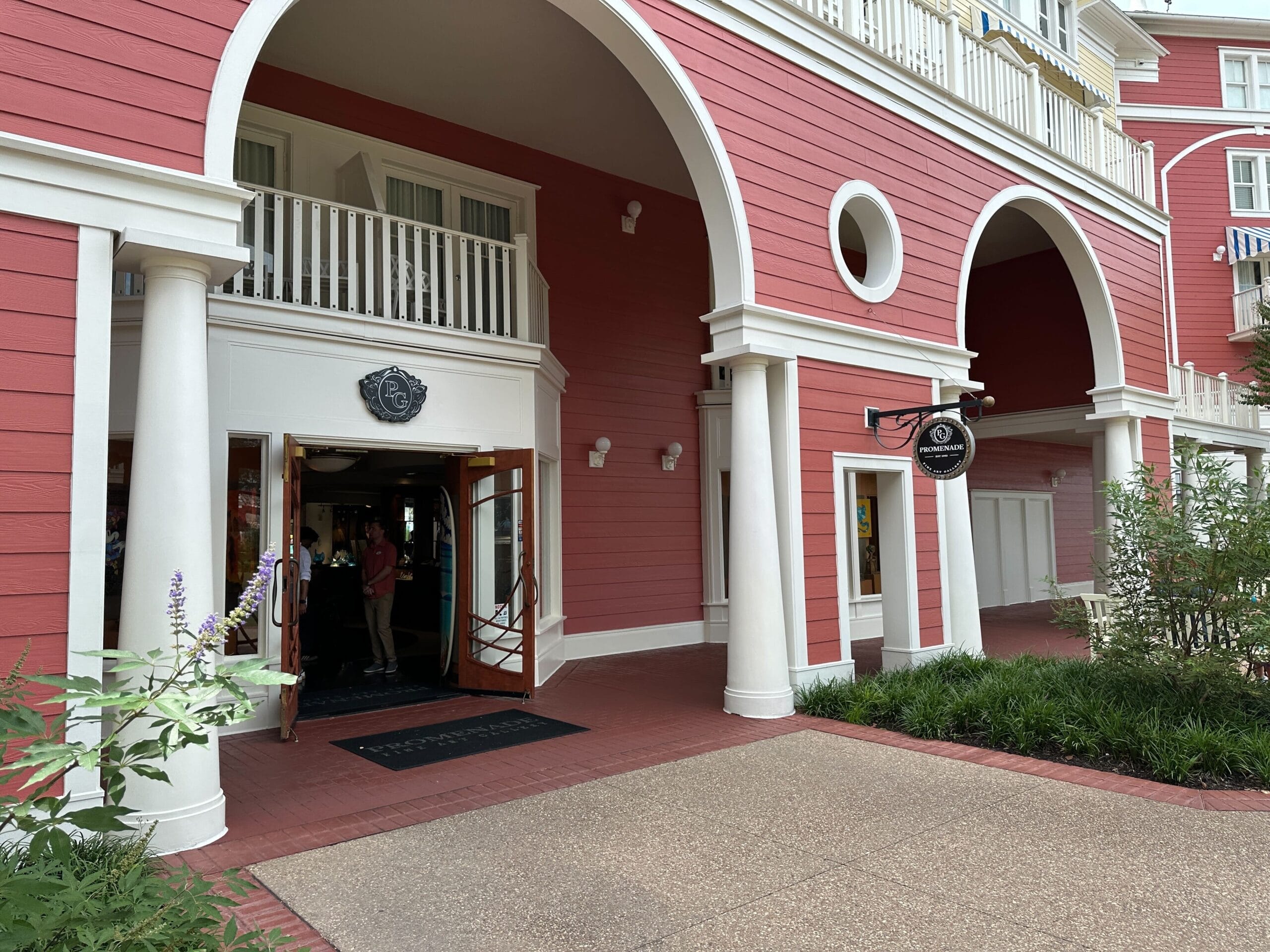 Pink building with white columns at Disney’s BoardWalk Resort, former site of the closed Promenade Fine Art Gallery. No castle views. Pink building with white columns at Disney’s BoardWalk Resort, former site of the closed Promenade Fine Art Gallery. No castle views.