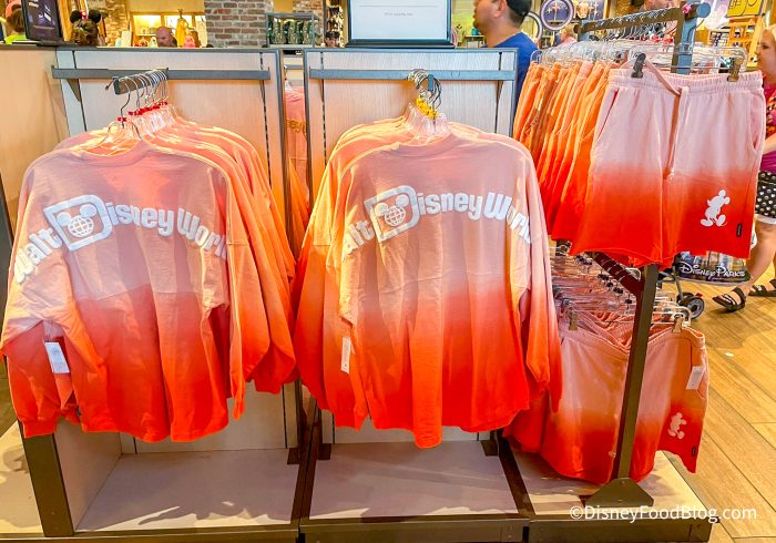 2022-wdw-disney-springs-world-of-disney-store-ombre-orange-spirit-jersey-and-shorts-700x490.jpg