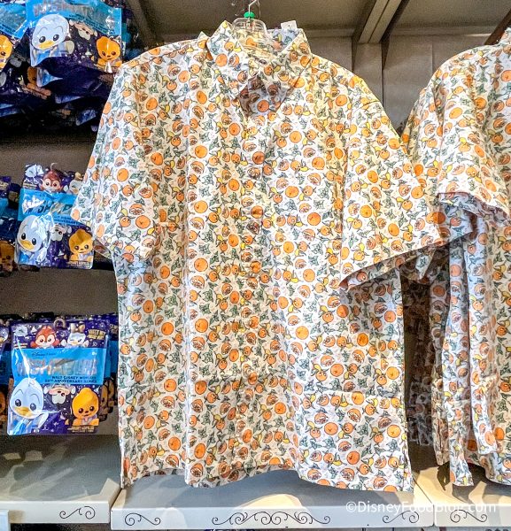 2022-wdw-magic-kingdom-main-street-the-emporium-store-orange-bird-button-down-shirt-577x600.jpg